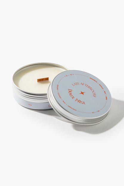 Doux Mist 3 oz tin candle with wooden wick, bergamot, rosemary, musk and amber